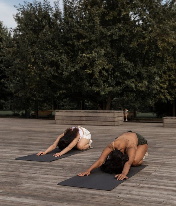 Woman in a calm yoga pose, embodying harmony and strength.